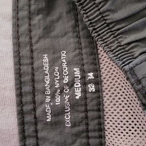 Mens Coleman olive green nylon shorts.